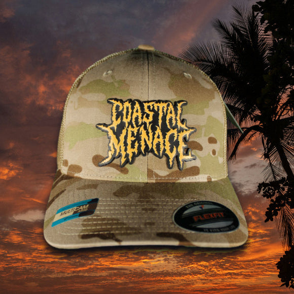 Camouflage cap with yellow 'Coastal Menage' logo against a sunset sky with palm trees.