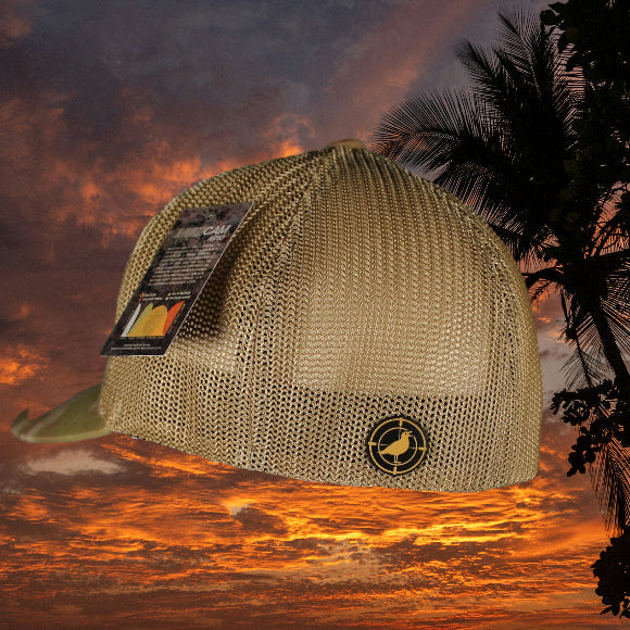 Beige cap with brand logo against a dramatic sky with palm trees