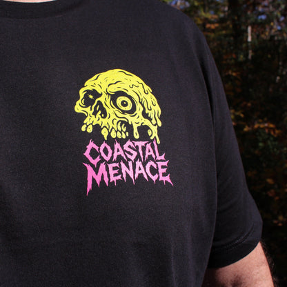 Black t-shirt with yellow skull design and 'Coastal Menace' text on a dark background