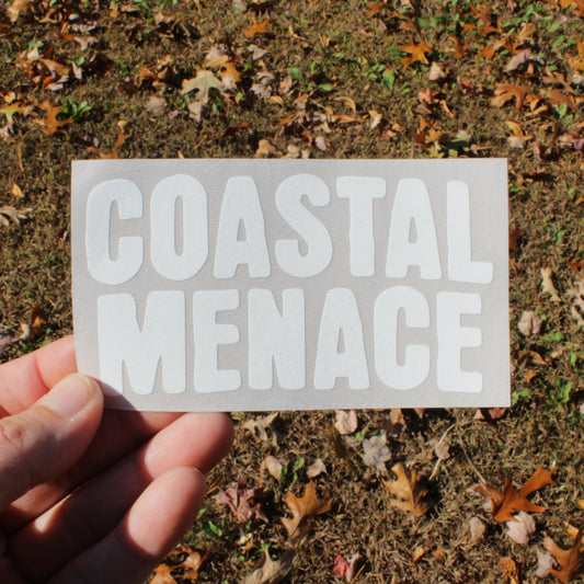 holding an awesome coastal menace decal