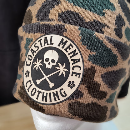 Closeup of duck camo beanie featuring Base Threat patch