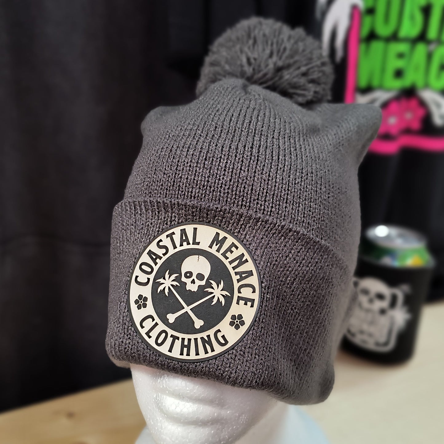 Grey pom Coastal Menace Base Threat beanie with skull and palms patch
