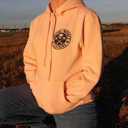 Front view of the Coastal Menace Base Threat pink hoodie with small chest logo.