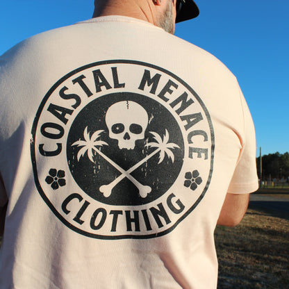 Back view of men’s Coastal Menace Base Threat pink t-shirt with large circular logo.