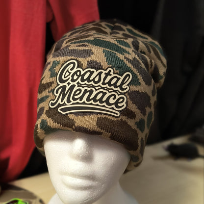 duck camo knit beanie with cream retro script Coastal Menace patch on the front
