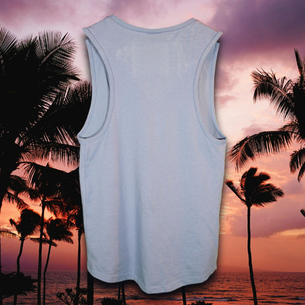 Back view of light blue Coastal Menace tank top with no graphic, photographed in front of a tropical sunset scene