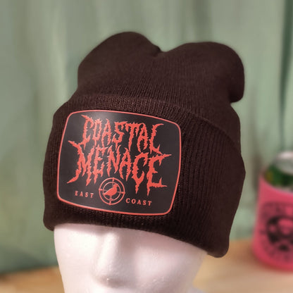 dark brown fowl play beanie with orange metal style patch